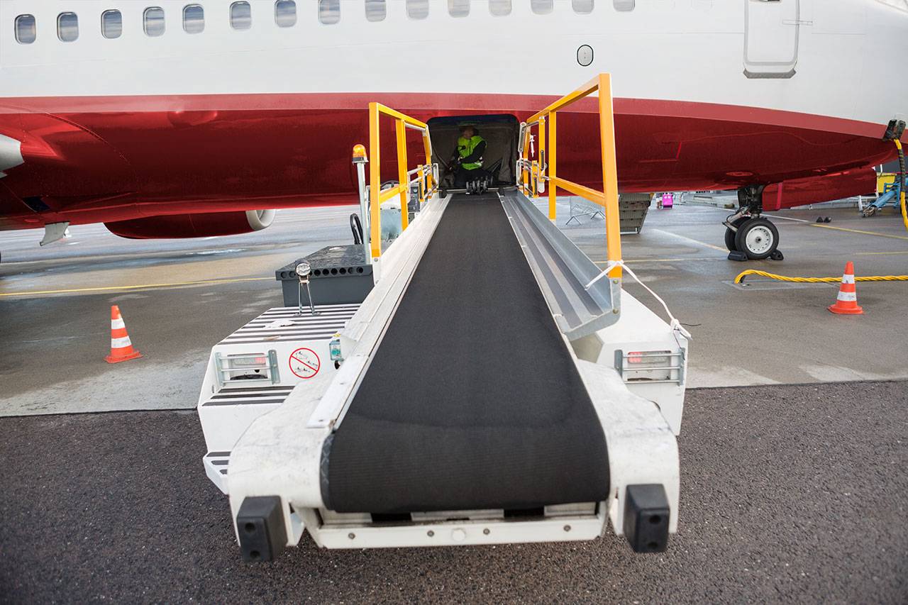 Airplane baggage conveyor